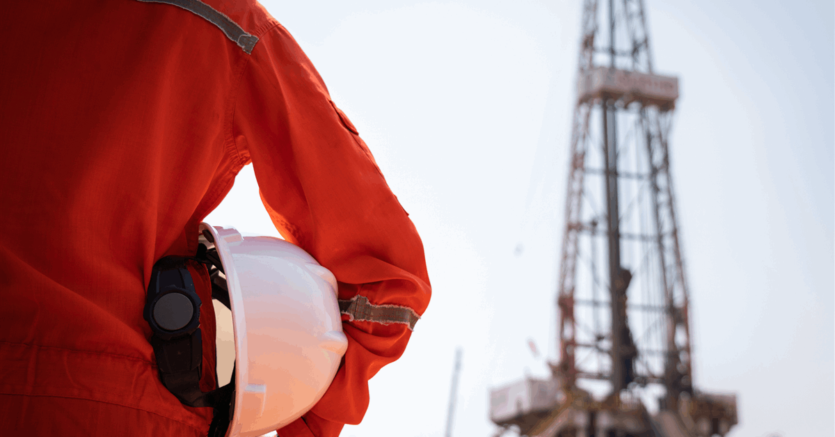 Oil drilling rig operating in a desert landscape