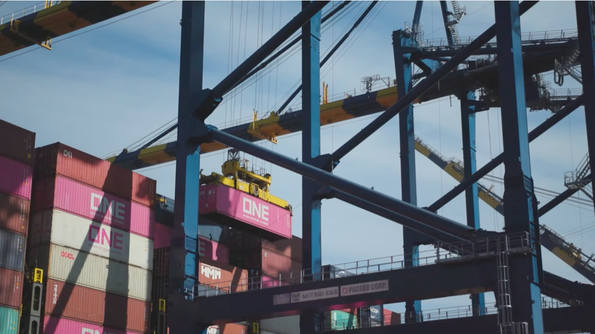 Container ships and cranes at a busy port terminal