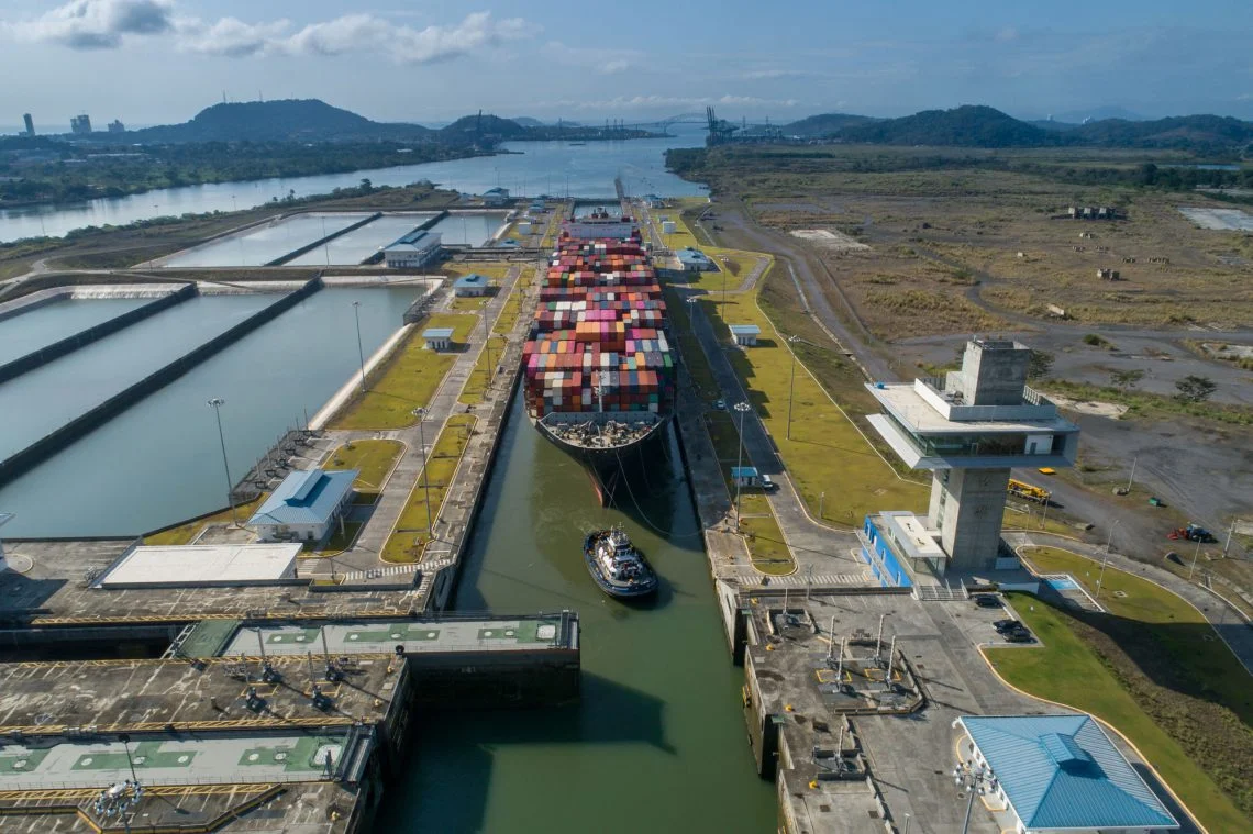 A large Neopanamax container ship transiting the Panama Canal.