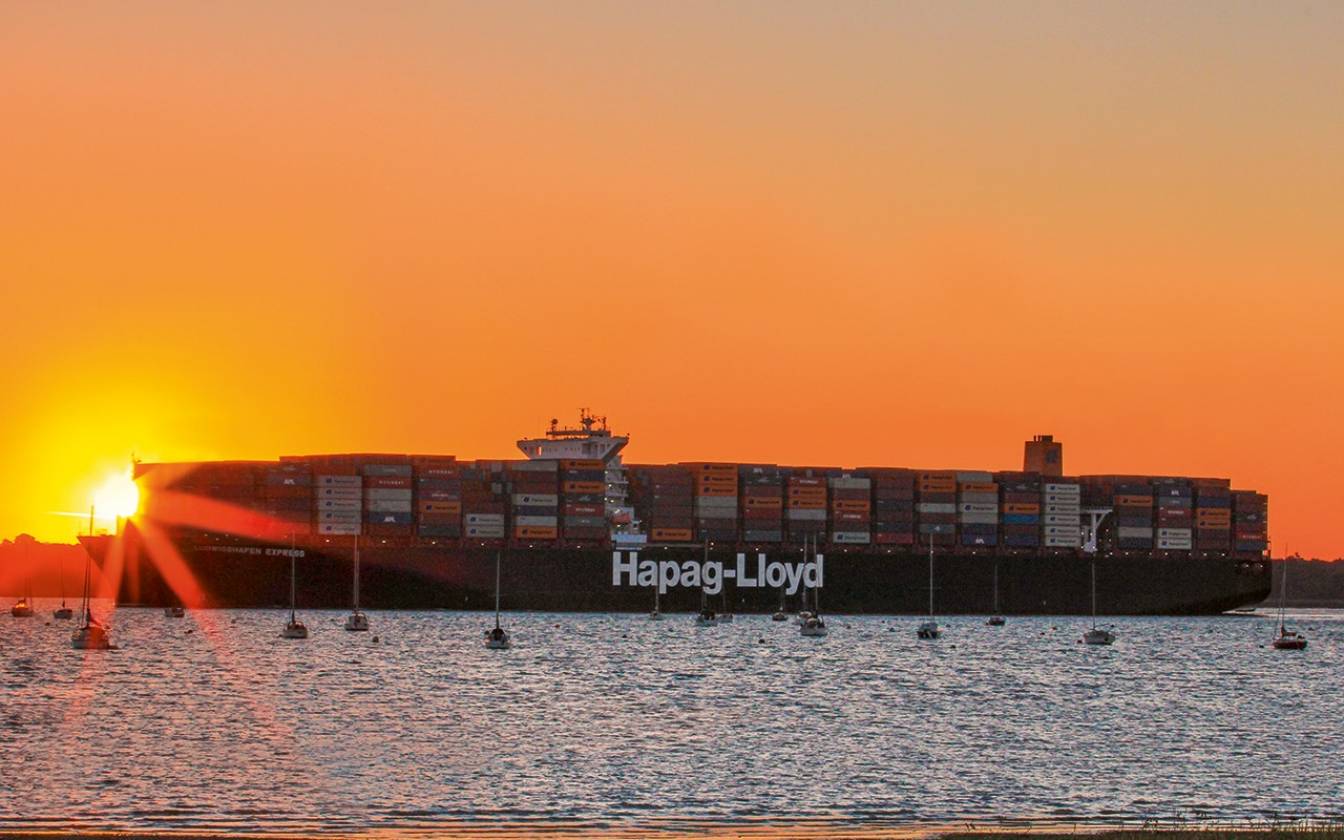 A container ship at sea, representing maritime logistics and shipping operations.