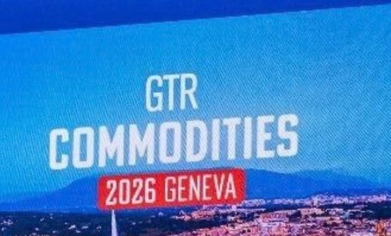 Attendees at a professional conference discussing commodity trading.
